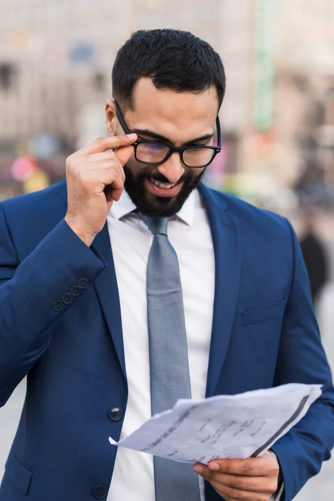 business-man-reading-Trade-Mark-Registration-License